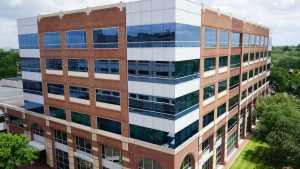 Elevated view of the Texas Drive building, an office over retail property in Sugar Land Town Square